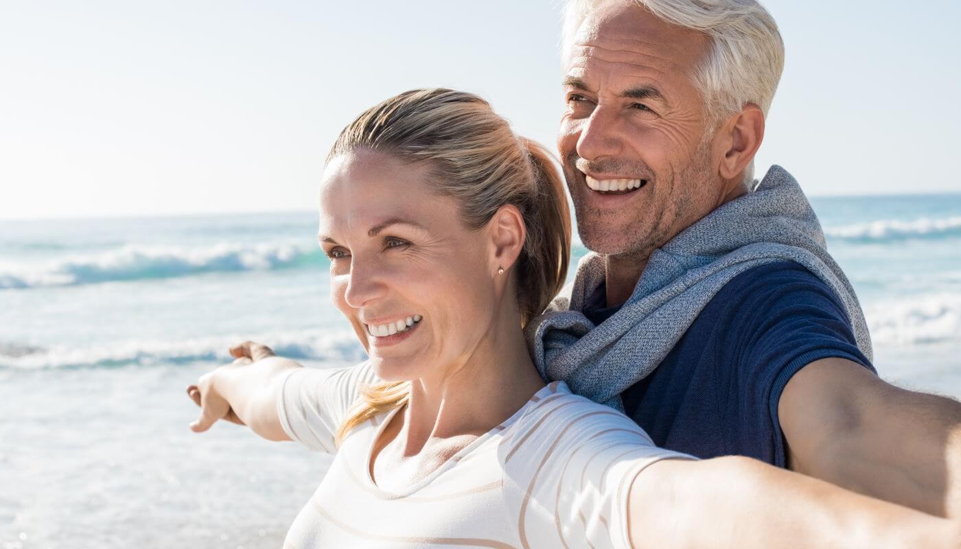 Man and woman with arms out as if flying